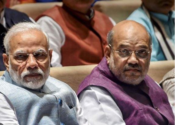 प्रधानमंत्री नरेंद्र मोदी संग केंद्रीय गृह मंत्री अमित शाह की फाइल फोटो